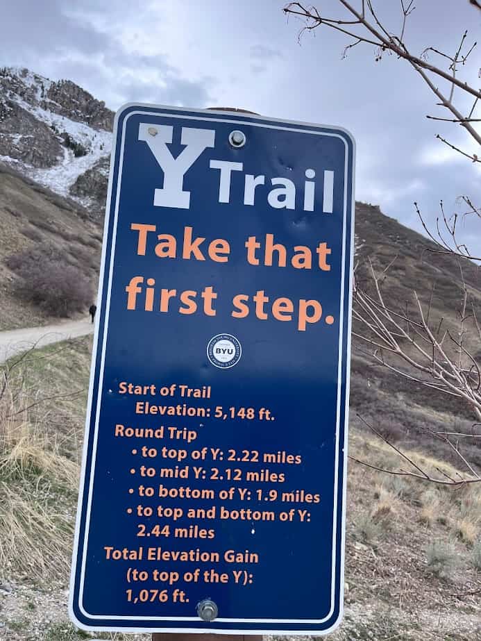 A sign on the Y trail reading "Take that first step."