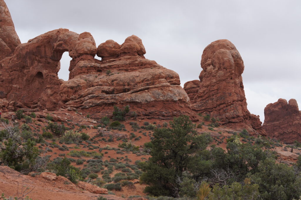 A view of Turret Arch on a cloudy day.