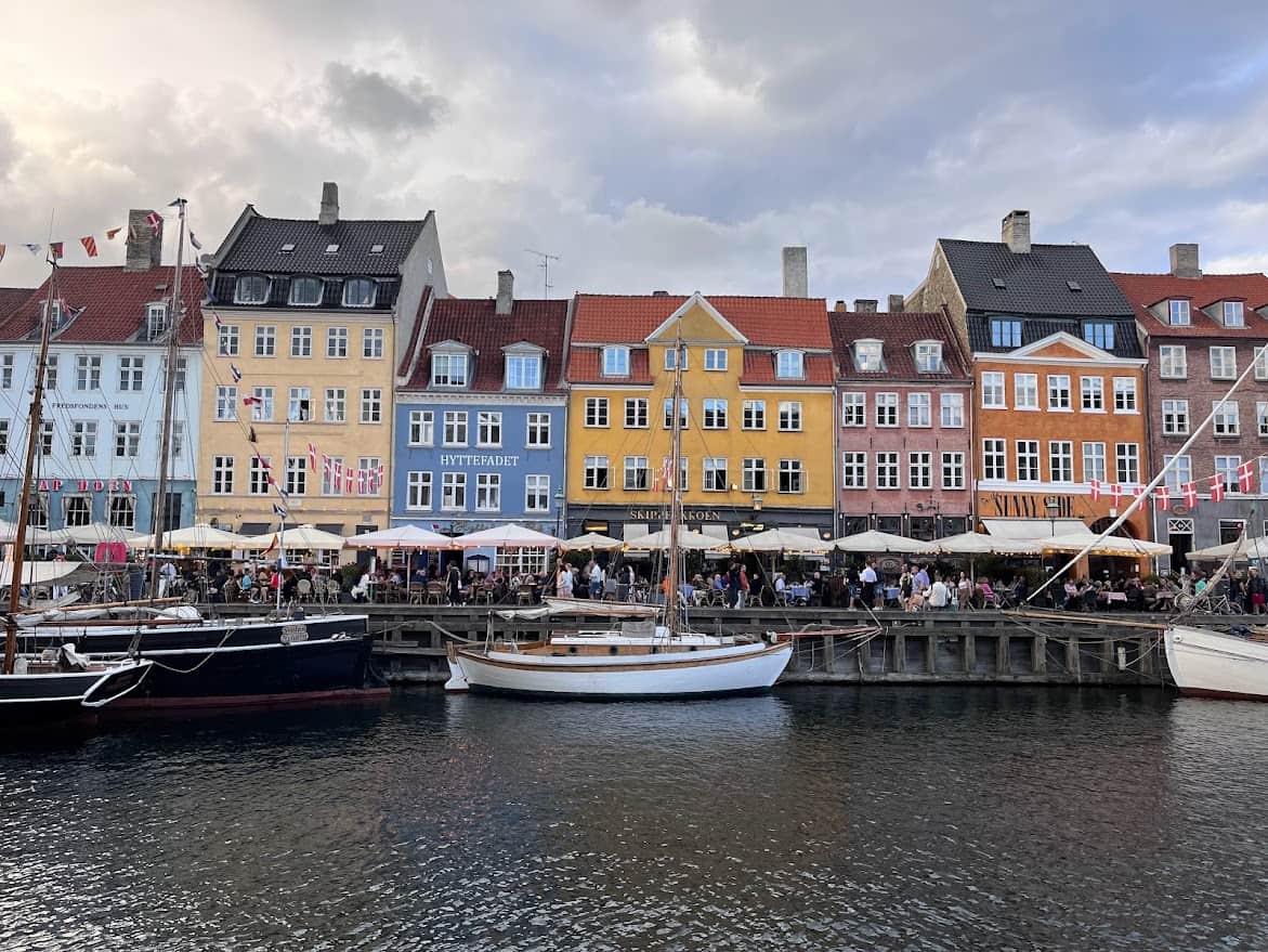 Copenhagen's iconic Nyhavn street with colorful houses in front of a canal.
